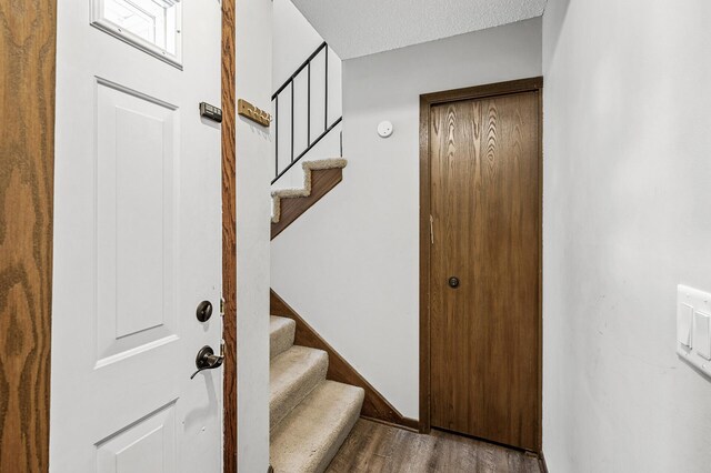2478 Cobble Hill Alcove Unit C, Woodbury, MN 55125 - staircase featuring wood finished floors