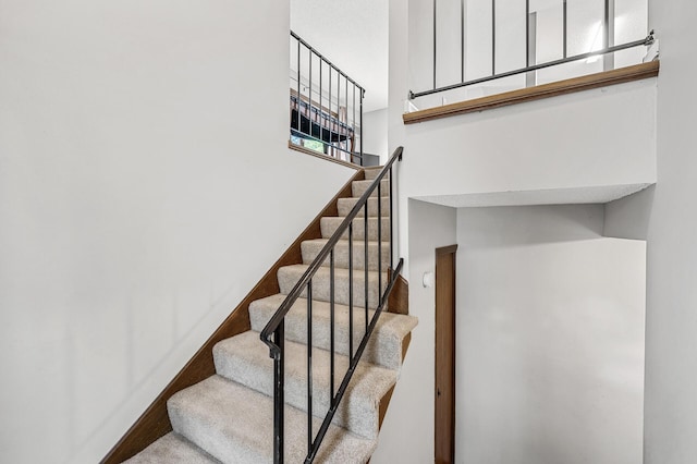 2478 Cobble Hill Alcove Unit C, Woodbury, MN 55125 - stairway featuring a towering ceiling