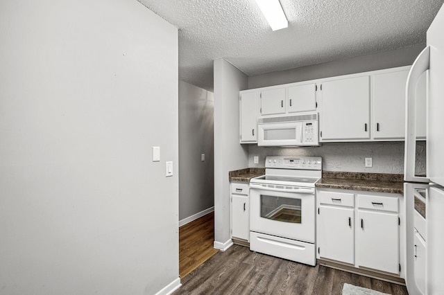 2478 Cobble Hill Alcove Unit C, Woodbury, MN 55125 - kitchen featuring white appliances, dark wood-type flooring, dark countertops, white cabinets, and a textured ceiling