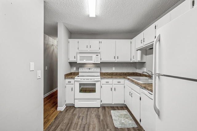 2478 Cobble Hill Alcove Unit C, Woodbury, MN 55125 - kitchen with white appliances, a sink, dark wood-type flooring, a textured ceiling, and dark countertops