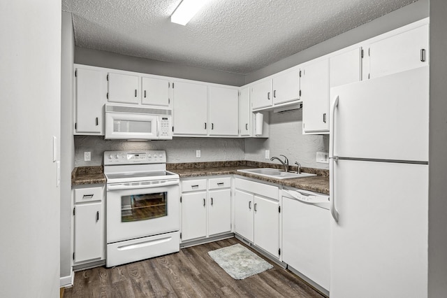 2478 Cobble Hill Alcove Unit C, Woodbury, MN 55125 - kitchen with white appliances, a sink, dark wood-style flooring, a textured ceiling, and dark countertops