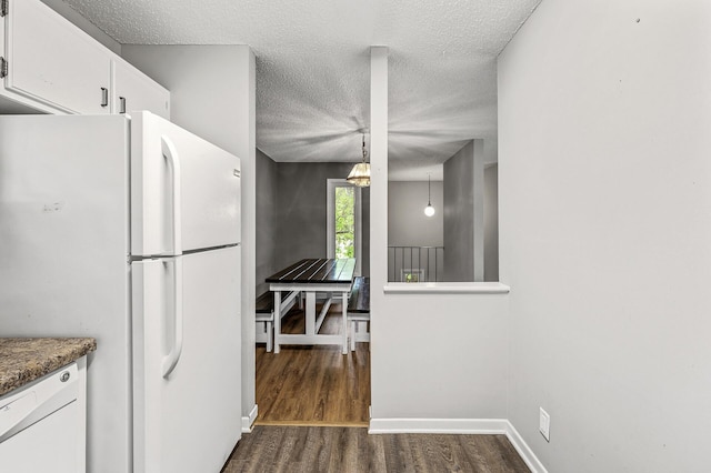 2478 Cobble Hill Alcove Unit C, Woodbury, MN 55125 - kitchen with white appliances, a textured ceiling, dark wood-type flooring, white cabinets, and baseboards