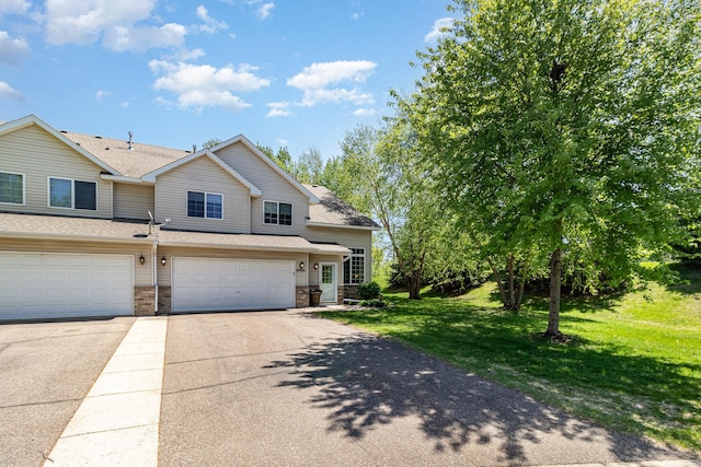 10916 181st Ln NW, Elk River, MN 55330 - view of front of property with driveway, a front lawn, a garage, and roof with shingles