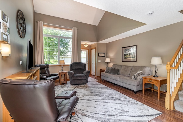 10916 181st Ln NW, Elk River, MN 55330 - living room with wood finished floors, stairs, and lofted ceiling