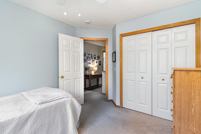 10916 181st Ln NW, Elk River, MN 55330 - bedroom featuring light carpet, a closet, a ceiling fan, and baseboards