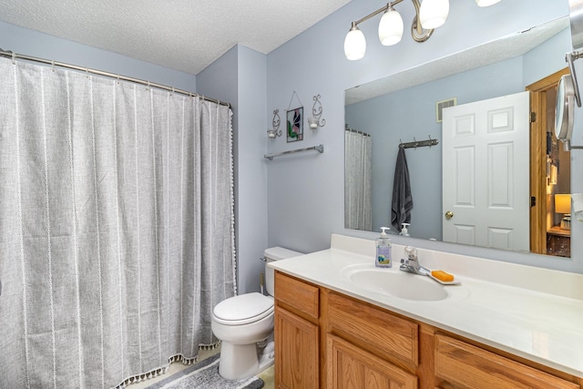10916 181st Ln NW, Elk River, MN 55330 - bathroom with toilet, vanity, and a textured ceiling