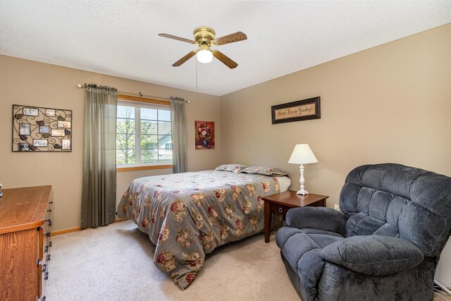 10916 181st Ln NW, Elk River, MN 55330 - bedroom featuring light colored carpet, baseboards, and ceiling fan