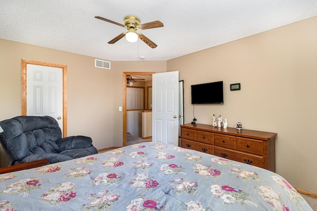 10916 181st Ln NW, Elk River, MN 55330 - carpeted bedroom featuring baseboards, a ceiling fan, and a textured ceiling