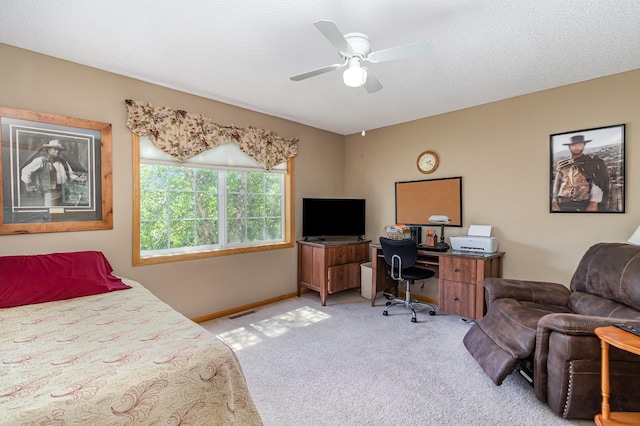 10916 181st Ln NW, Elk River, MN 55330 - bedroom with light carpet, an office area, baseboards, and ceiling fan