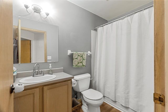 full bathroom featuring toilet and vanity