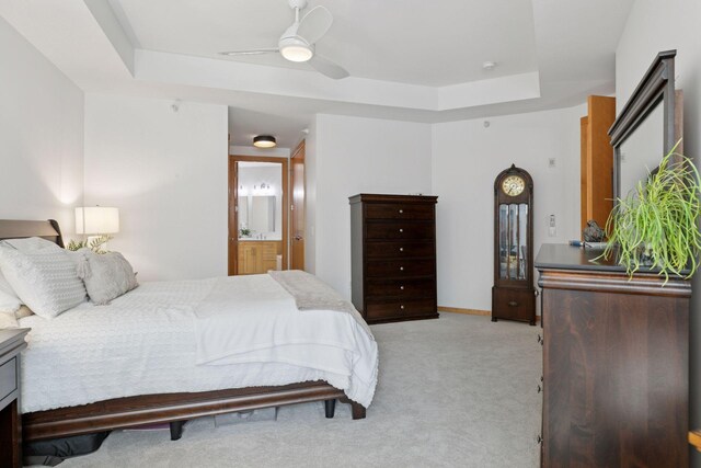 501 Main St N Unit 409, Stillwater, MN 55082 - carpeted bedroom with a raised ceiling, ensuite bath, and ceiling fan