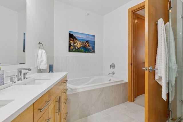 501 Main St N Unit 409, Stillwater, MN 55082 - bathroom featuring a garden tub, double vanity, and tile patterned floors