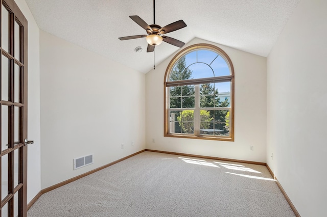 24107 Rivers Edge Rd, Rogers, MN 55374 - carpeted spare room with vaulted ceiling, a ceiling fan, and baseboards