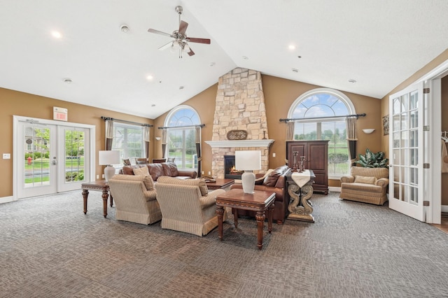 24107 Rivers Edge Rd, Rogers, MN 55374 - living area with carpet flooring, a ceiling fan, a fireplace, french doors, and high vaulted ceiling