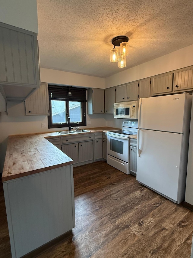 504 Fallwood Rd, Redwood Falls, MN 56283 - kitchen with white appliances, a textured ceiling, gray cabinets, dark wood-style flooring, and light countertops