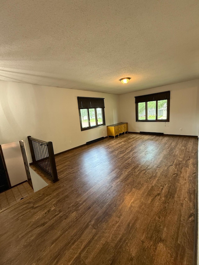 504 Fallwood Rd, Redwood Falls, MN 56283 - spare room with wood finished floors and a textured ceiling