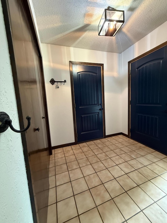 504 Fallwood Rd, Redwood Falls, MN 56283 - entrance foyer featuring a textured ceiling and light tile patterned floors