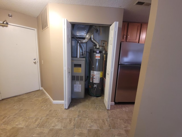 utility room with water heater