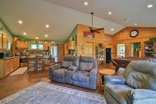 21097 Gilmer Rd, Crosby, MN 56441 - living room with wood finished floors, wood walls, ceiling fan, recessed lighting, and high vaulted ceiling