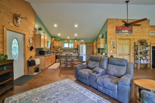 21097 Gilmer Rd, Crosby, MN 56441 - living area featuring wood walls, dark wood-style flooring, high vaulted ceiling, a ceiling fan, and recessed lighting