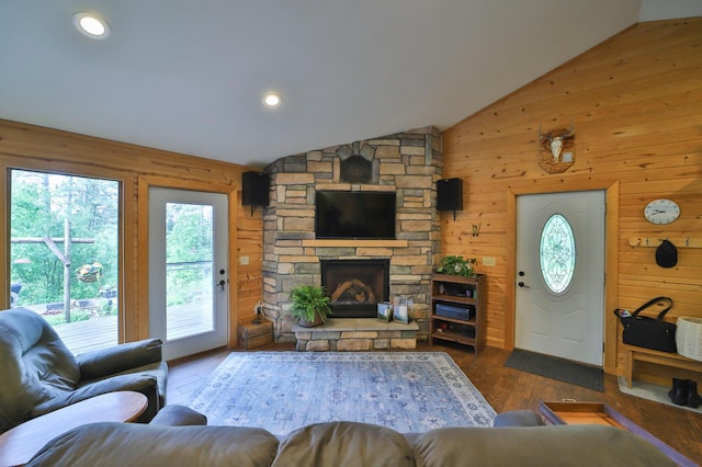 21097 Gilmer Rd, Crosby, MN 56441 - living room with plenty of natural light, wood walls, vaulted ceiling, a fireplace, and wood finished floors