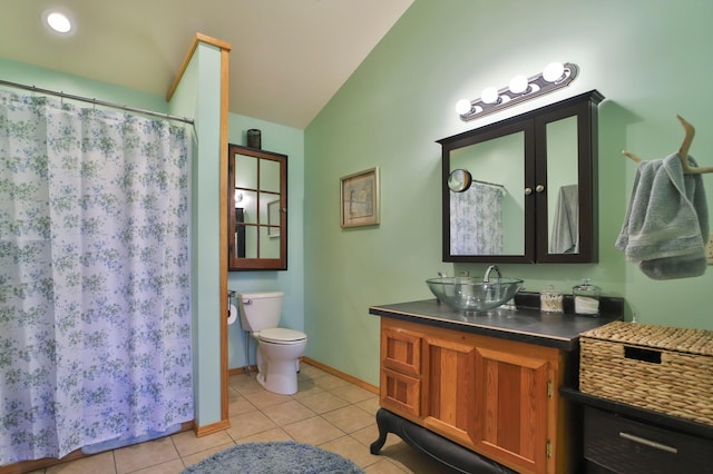 21097 Gilmer Rd, Crosby, MN 56441 - full bathroom featuring tile patterned flooring, lofted ceiling, vanity, toilet, and baseboards