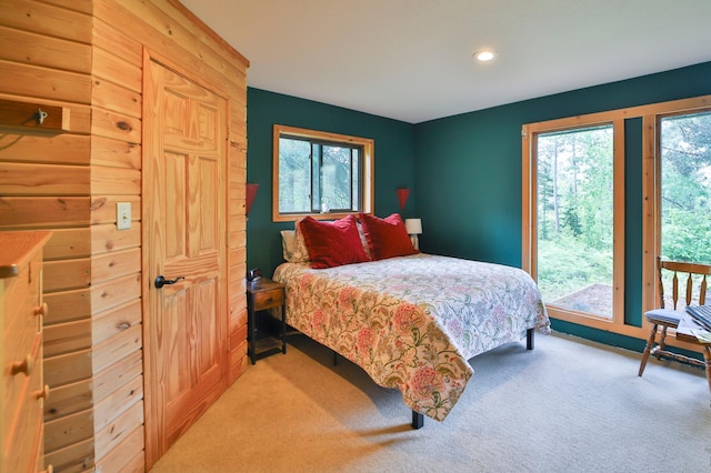 21097 Gilmer Rd, Crosby, MN 56441 - bedroom with access to exterior, multiple windows, light colored carpet, and recessed lighting