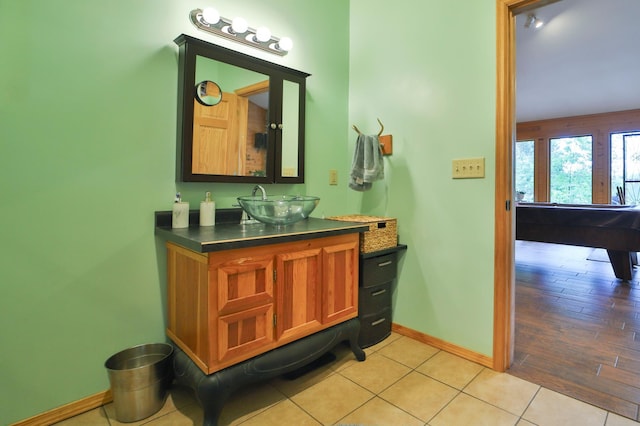 21097 Gilmer Rd, Crosby, MN 56441 - bathroom featuring baseboards, vanity, and tile patterned flooring