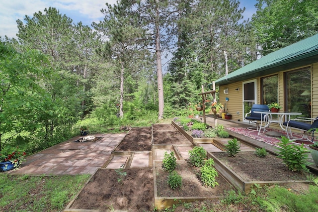 21097 Gilmer Rd, Crosby, MN 56441 - view of patio with a vegetable garden and a wooden deck