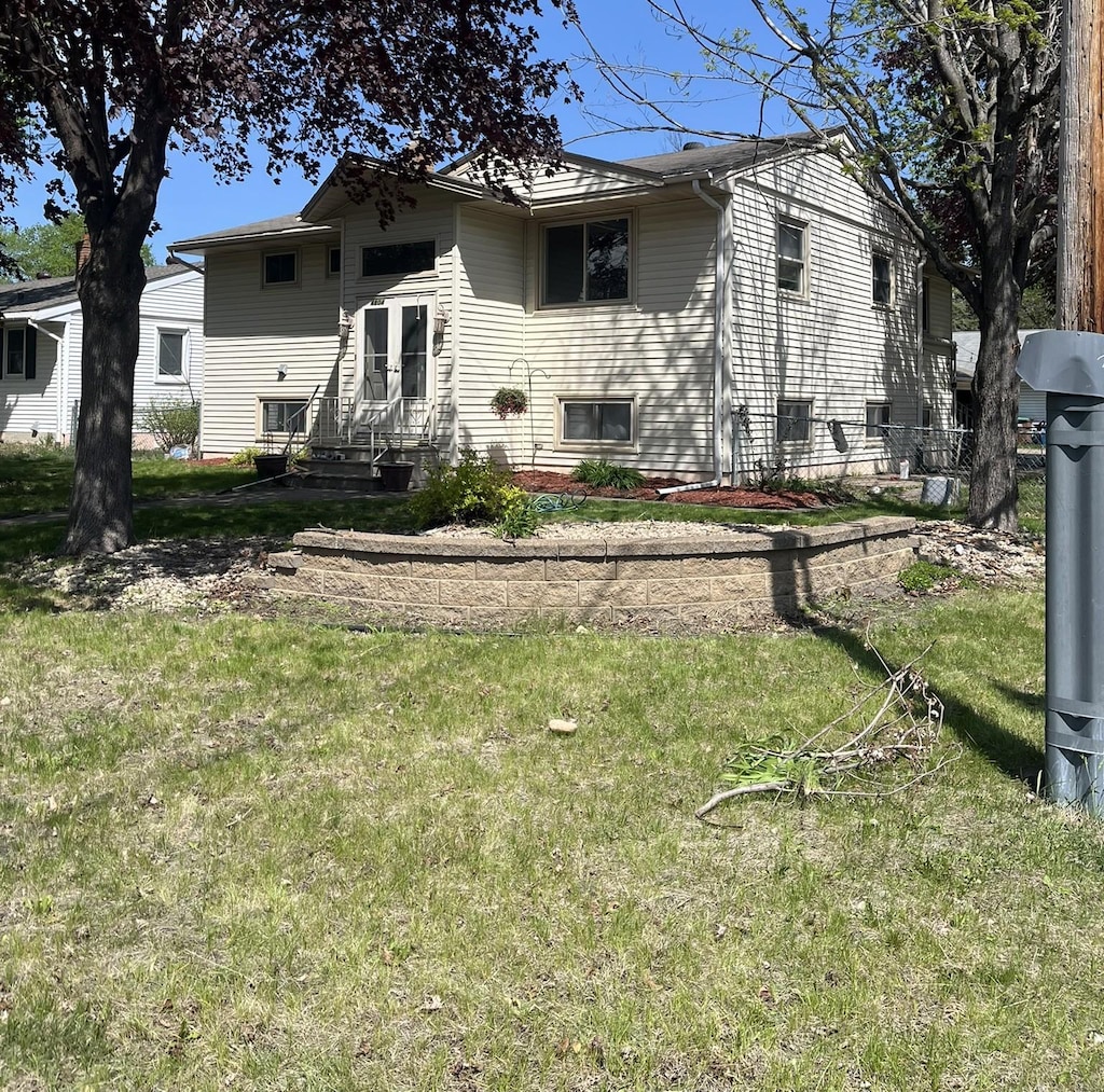 back of house with a yard