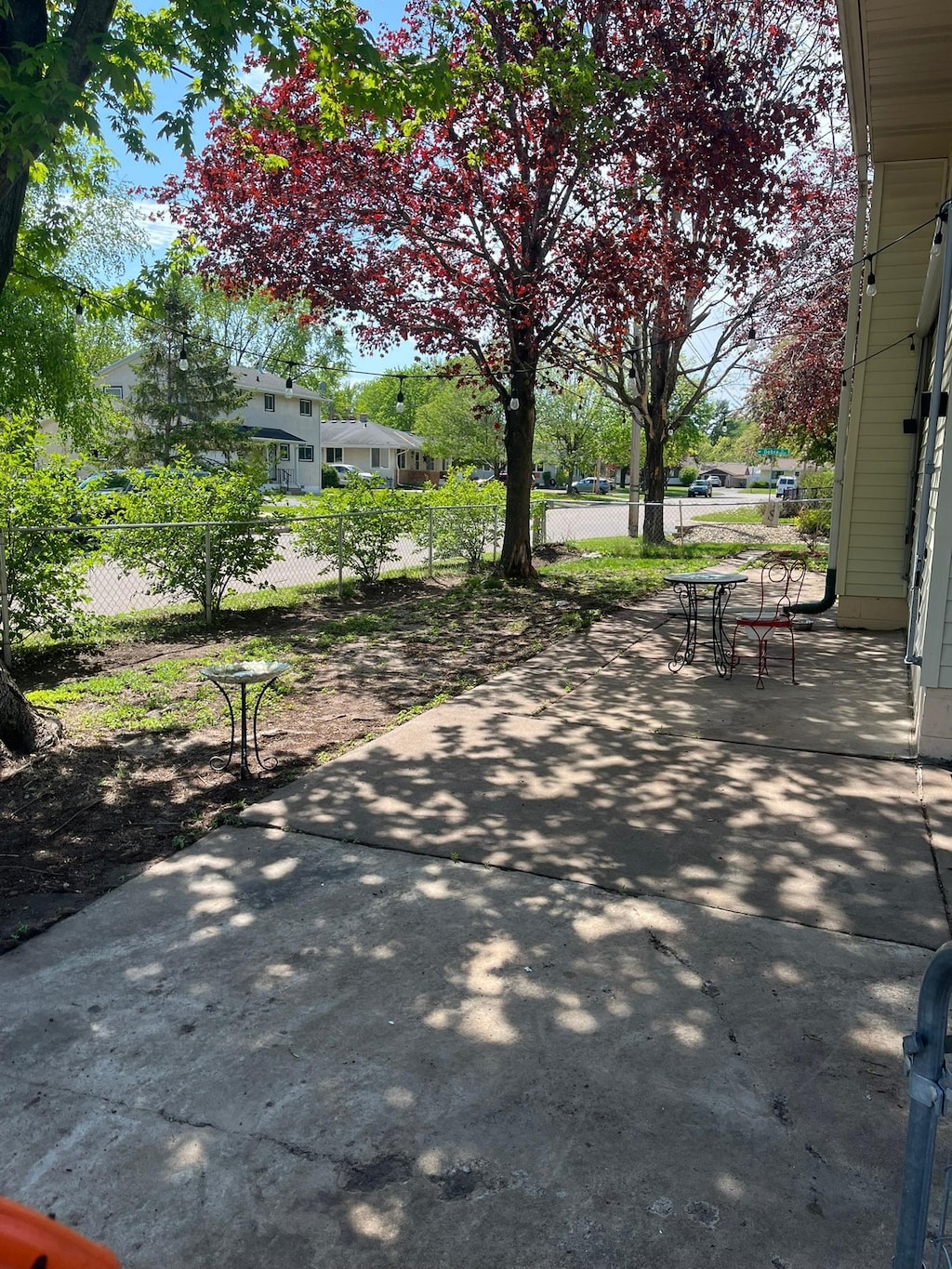 view of community featuring a patio and fence