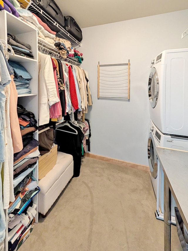 521 2nd St SE Unit 206, Minneapolis, MN 55414 - spacious closet featuring stacked washer / dryer and carpet flooring