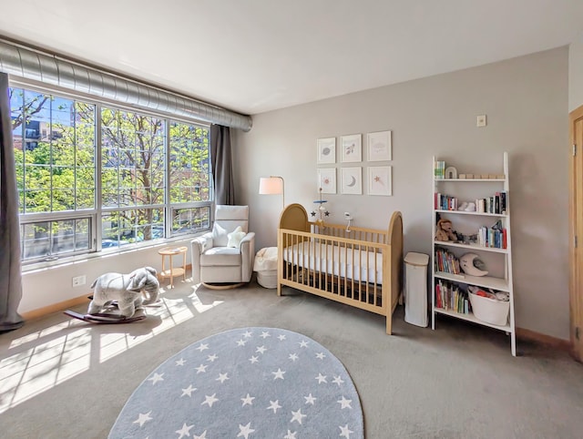 521 2nd St SE Unit 206, Minneapolis, MN 55414 - carpeted bedroom with a crib