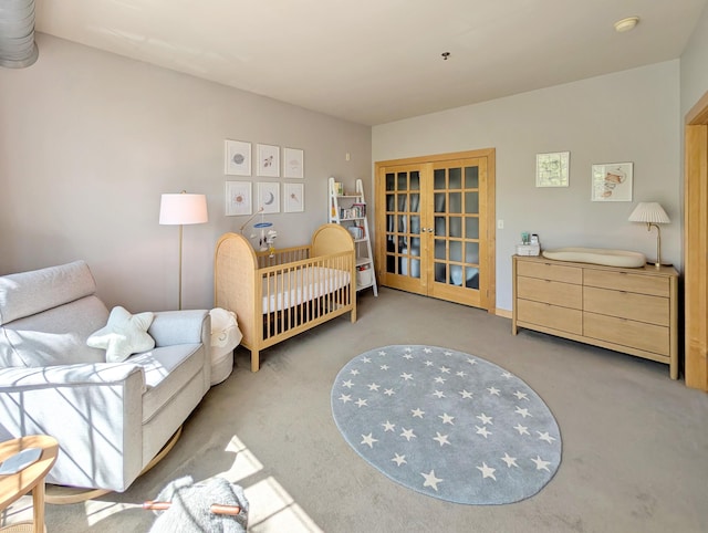 521 2nd St SE Unit 206, Minneapolis, MN 55414 - carpeted bedroom featuring french doors