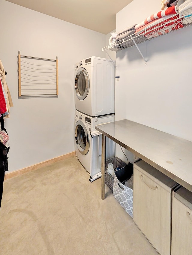 521 2nd St SE Unit 206, Minneapolis, MN 55414 - laundry room with stacked washer and clothes dryer, light carpet, and baseboards