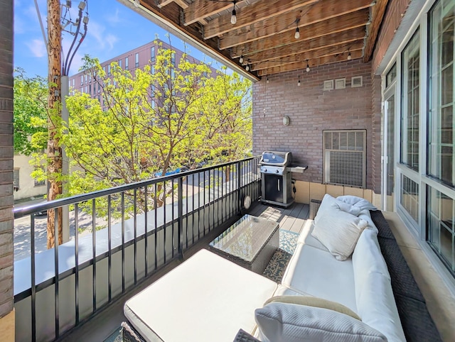 521 2nd St SE Unit 206, Minneapolis, MN 55414 - balcony featuring a grill and an outdoor living space