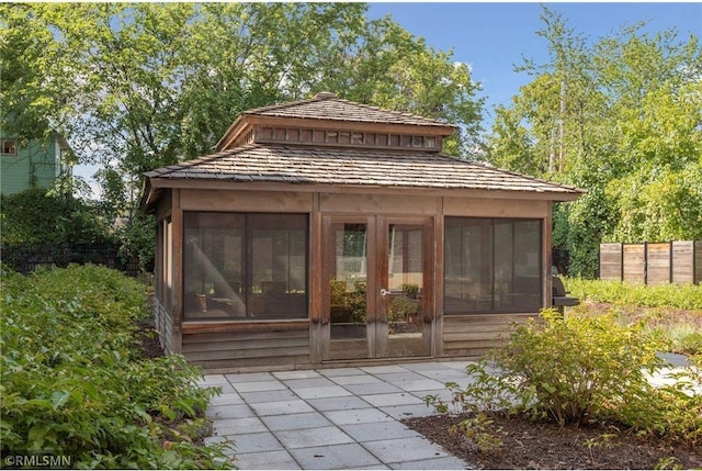 521 2nd St SE Unit 206, Minneapolis, MN 55414 - view of outbuilding featuring a sunroom and fence