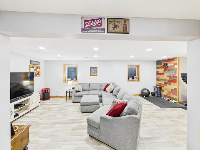 living room featuring recessed lighting, light wood-style flooring, and baseboards