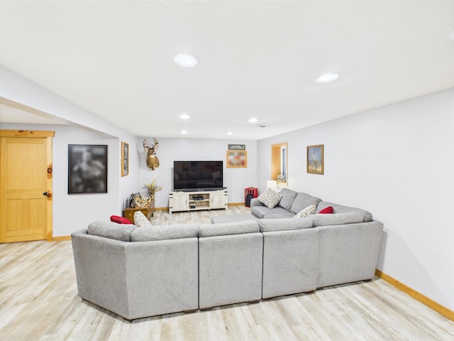 living room with wood finished floors, recessed lighting, and baseboards
