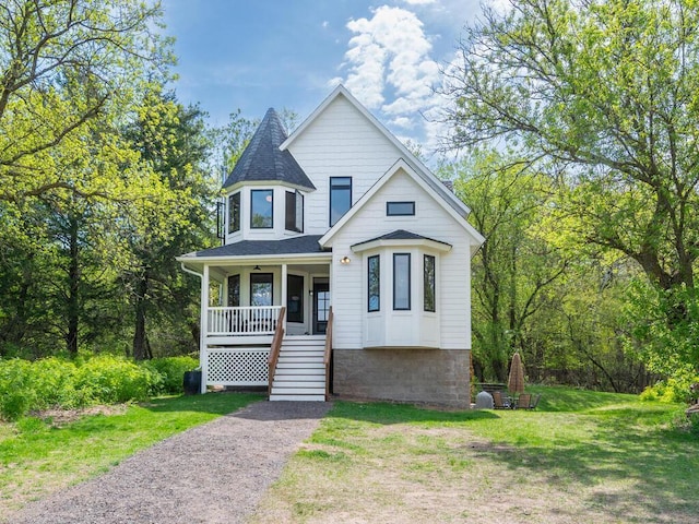 41218 Nelson Rd, North Branch, MN 55056 - victorian-style house with covered porch, stairway, a front lawn, and a shingled roof