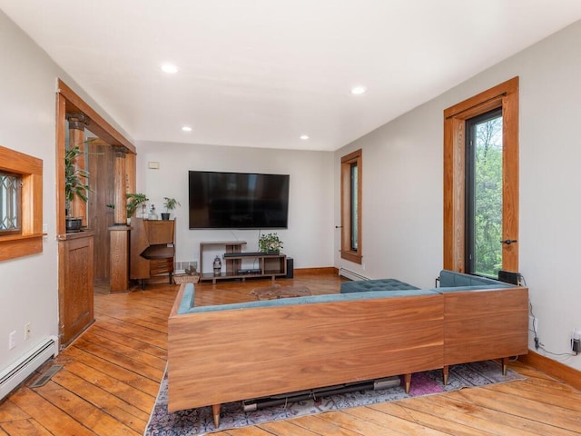 41218 Nelson Rd, North Branch, MN 55056 - living area featuring baseboard heating, wood-type flooring, and recessed lighting