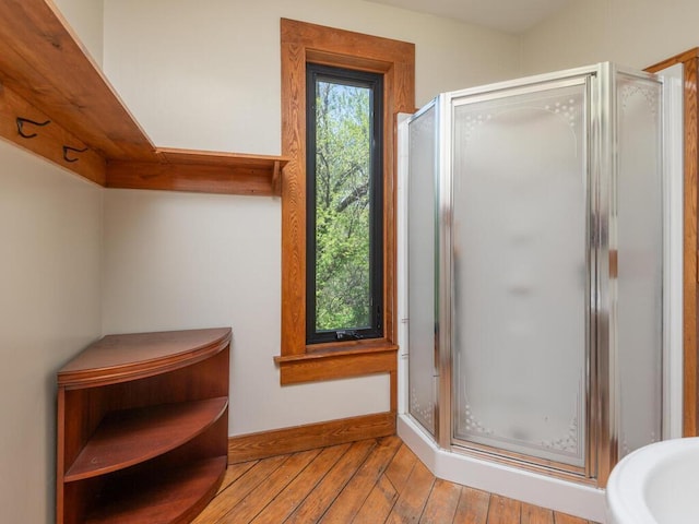 41218 Nelson Rd, North Branch, MN 55056 - full bath with wood-type flooring, a shower stall, and baseboards