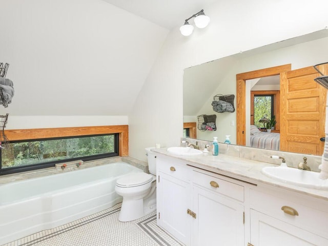 41218 Nelson Rd, North Branch, MN 55056 - full bath featuring vaulted ceiling, connected bathroom, double vanity, a bath, and toilet