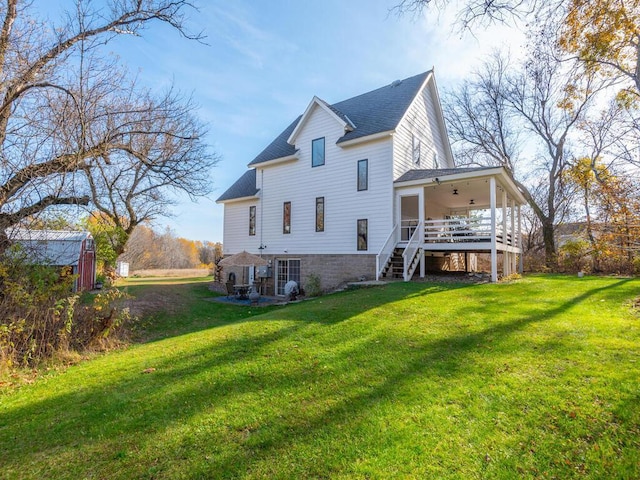 41218 Nelson Rd, North Branch, MN 55056 - back of property featuring stairs, a yard, roof with shingles, and an outdoor structure