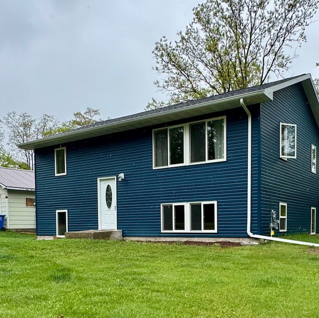 1123 Tyler Ave SE, Bemidji Twp, MN 56601 - back of property featuring a lawn