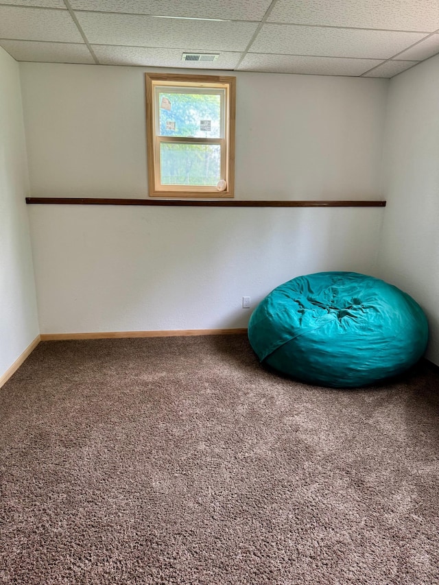 1123 Tyler Ave SE, Bemidji Twp, MN 56601 - spare room featuring a drop ceiling, carpet flooring, and baseboards