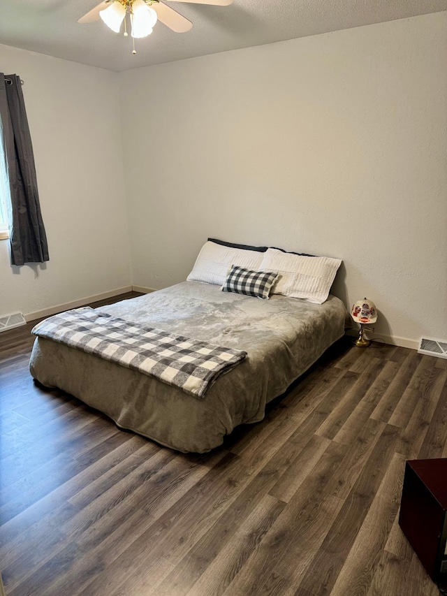 1123 Tyler Ave SE, Bemidji Twp, MN 56601 - bedroom featuring dark wood-type flooring, baseboards, and ceiling fan
