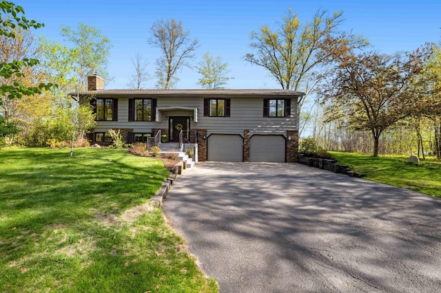19800 See Gull Rd, Brainerd, MN 56401 - bi-level home with driveway, a chimney, an attached garage, and a front yard