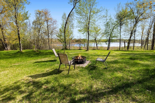 19800 See Gull Rd, Brainerd, MN 56401 - view of green lawn featuring an outdoor fire pit and a water view