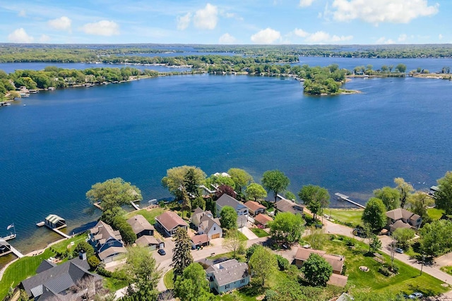 aerial view of residential area with a large body of water